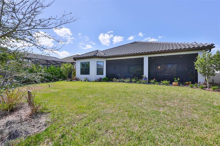 Exterior details and patio area of a home in Esplanade at Artisan Lakes, Palmetto (Image 24).