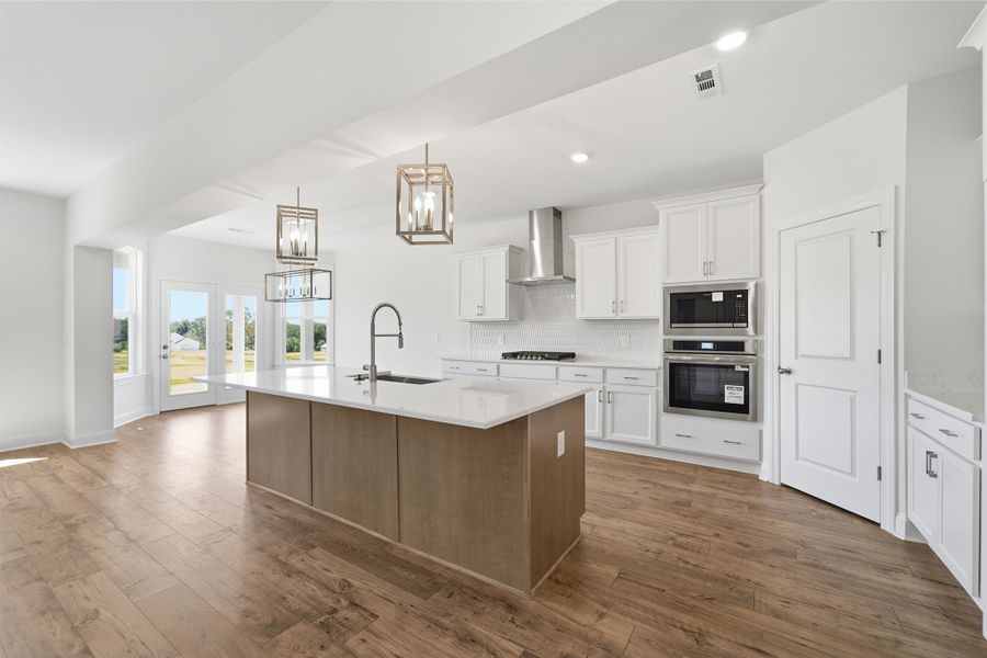 Furnished interior view inside a new home in Aden Woods, Fairview (Image 7).