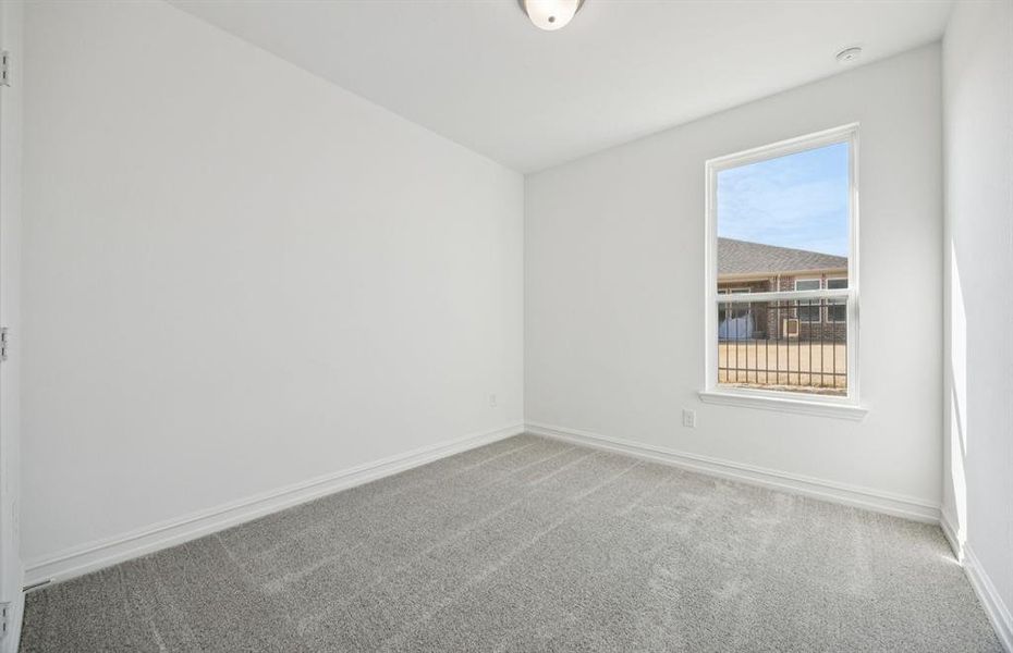 Spacious secondary bedroom.