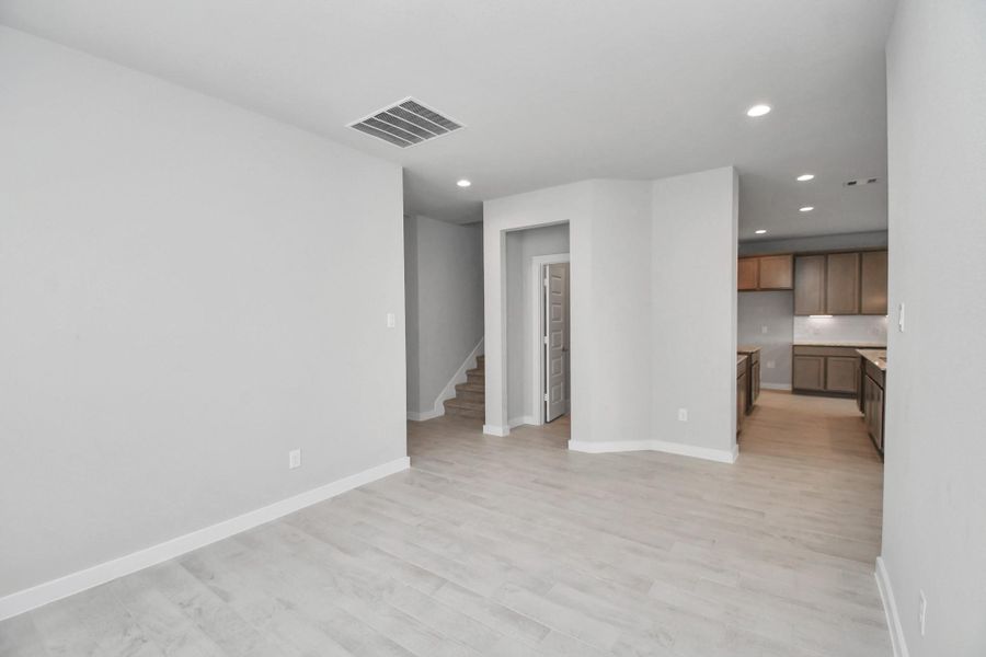 Make memories gathered around the table with your family and friends! This spacious dining room features elegant flooring, custom paint, and adjacent to family room and kitchen for open concept feel. Sample photo of completed home with similar floor plan. Actual colors and selections may vary. Make memories gathered around the table with your family and friends! This spacious dining room features elegant flooring, custom paint, and adjacent to family room and kitchen for open concept feel. Sample photo of completed home with similar floor plan. Actual colors and selections may vary.