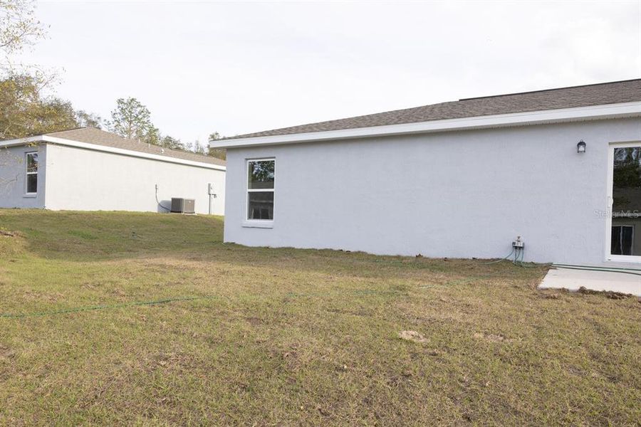 Exterior details and patio area of a home in , Citrus Springs (Image 26).