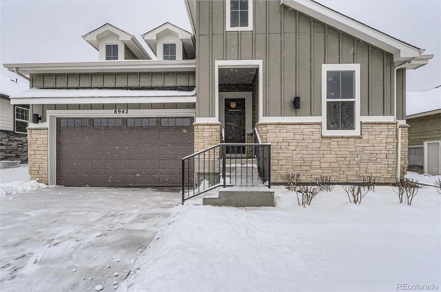 Front exterior of a new home in Hilltop 55+ at Inspiration, Aurora, CO, highlighting curb appeal (Image 2). Front exterior of a new home in Hilltop 55+ at Inspiration, Aurora, CO, highlighting curb appeal (Image 2).