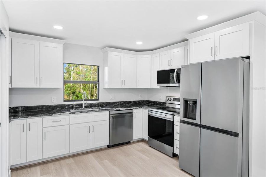 Furnished interior view inside a new home in , Punta Gorda (Image 10). Furnished interior view inside a new home in , Punta Gorda (Image 10).
