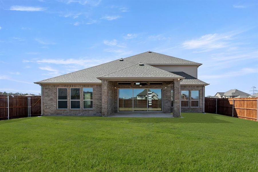 Exterior details and patio area of a home in High Country, Burleson (Image 3).
