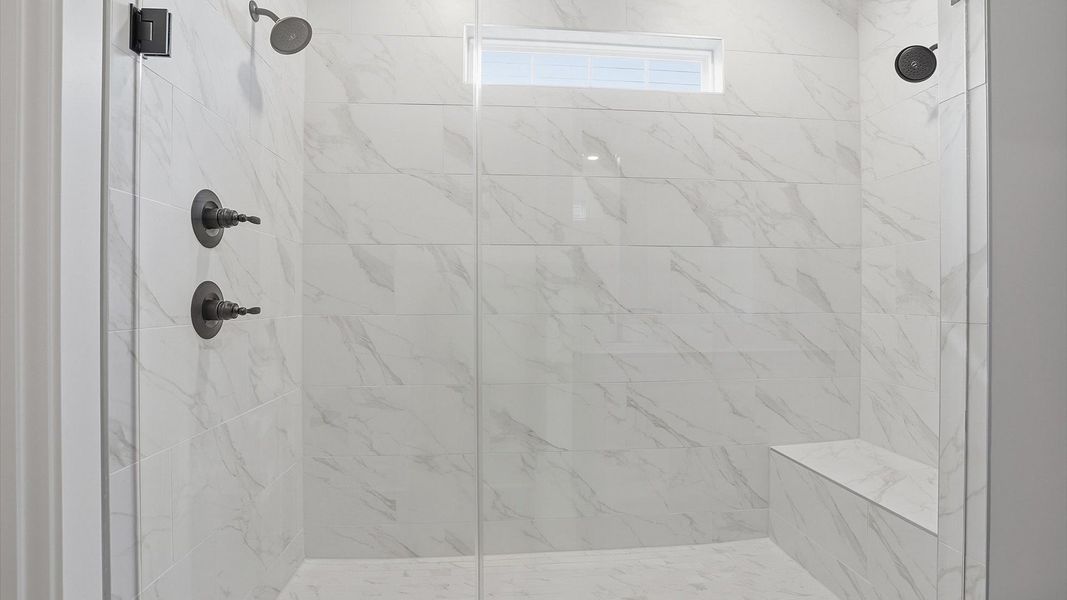 Memorable mornings begin in this elegant primary bathroom with walk-in shower and premium fixtures located in Woodruff, SC Memorable mornings begin in this elegant primary bathroom with walk-in shower and premium fixtures located in Woodruff, SC