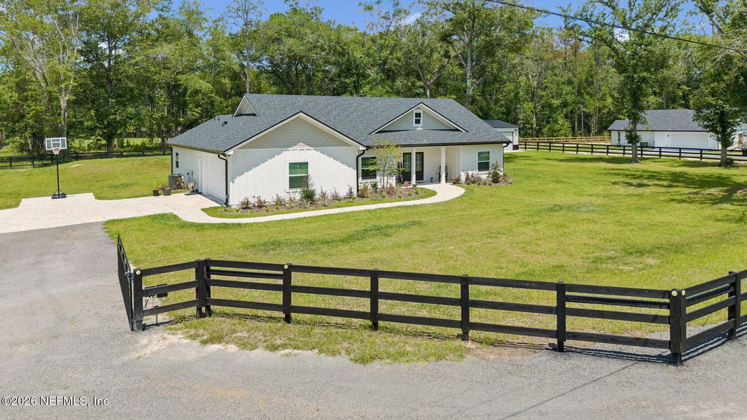 Front exterior of a new home in , Macclenny, FL, highlighting curb appeal (Image 23). Front exterior of a new home in , Macclenny, FL, highlighting curb appeal (Image 23).