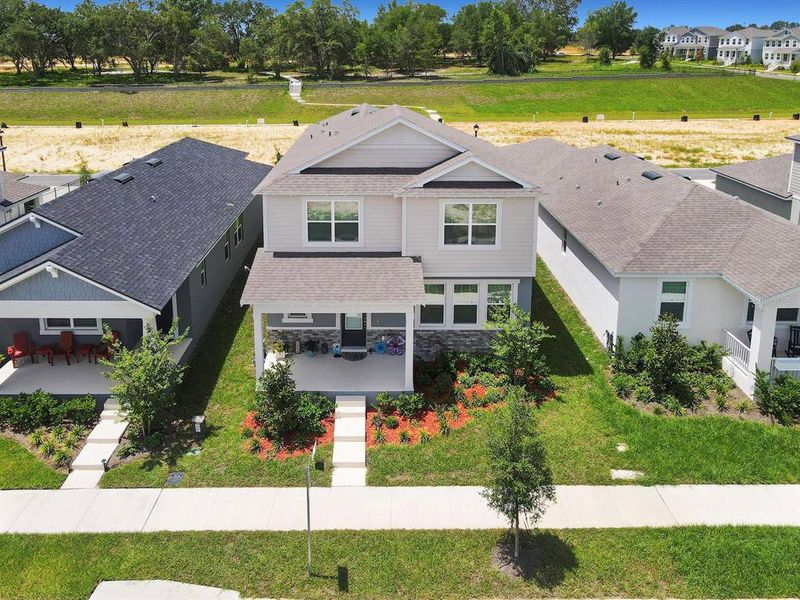 Front exterior of a new home in , Groveland, FL, highlighting curb appeal (Image 27).