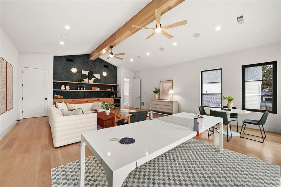 Living area with light wood-style flooring, a ceiling fan, wine cooler, and recessed lighting Living area with light wood-style flooring, a ceiling fan, wine cooler, and recessed lighting