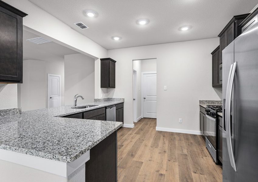 The kitchen has plenty of counterspace to make the cooking and cleaning process easier than ever.