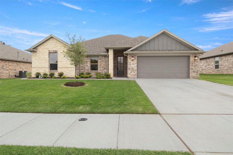 Front exterior of a new home in , Saginaw, TX, highlighting curb appeal (Image 22).