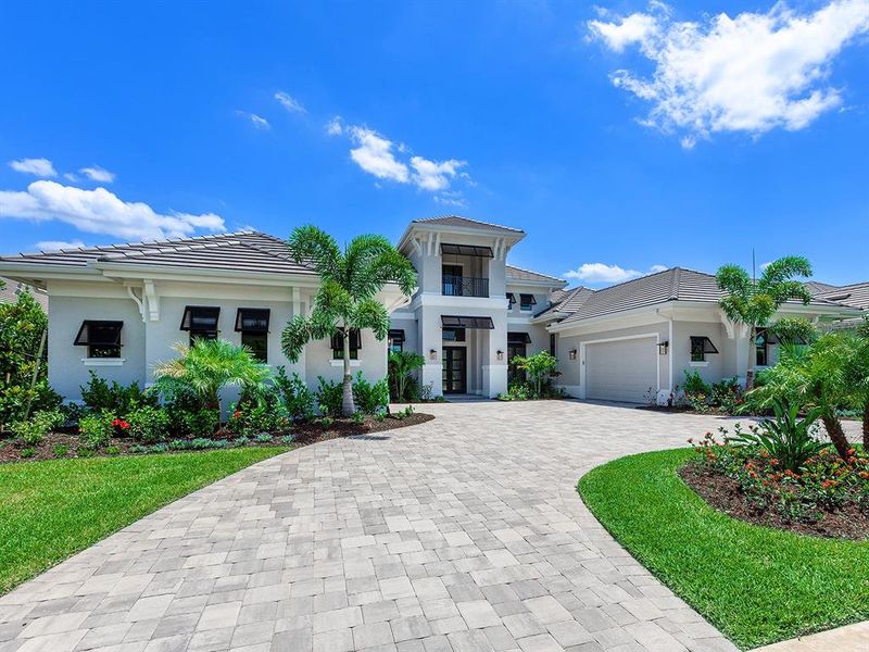 Front exterior of a new home in , Sarasota, FL, highlighting curb appeal (Image 30).