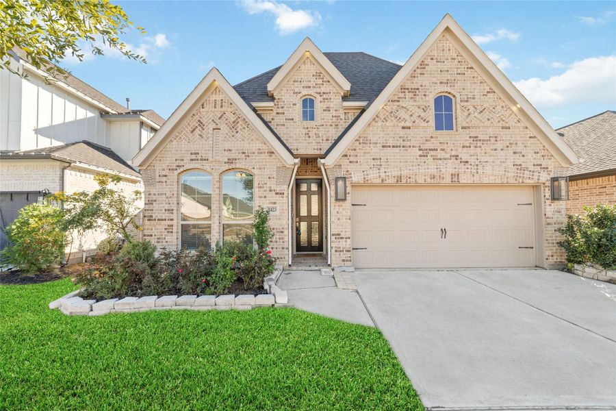 Front exterior of a new home in , Fulshear, TX, highlighting curb appeal (Image 2).