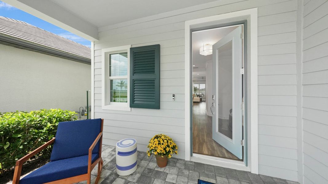 Exterior details and patio area of a home in SkySail Real Estate and Homes for Sale in Naples, FL - Neal Communities, Naples (Image 3).