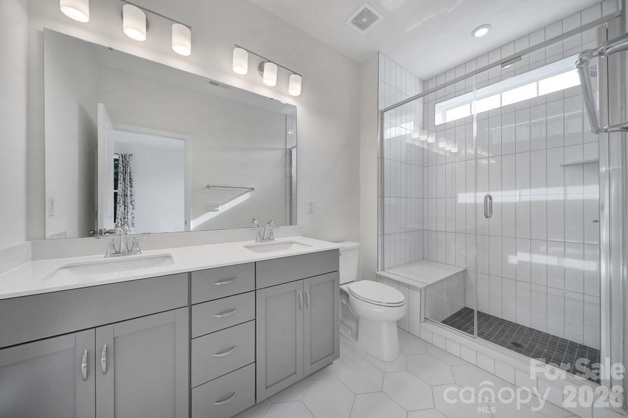 Primary Bath - Quartz Vanity, Tile Shower, Tile Floors