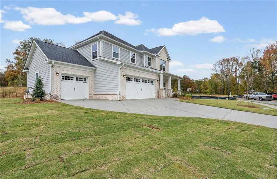 Front exterior of a new home in Arden, Cumming, GA, highlighting curb appeal (Image 27).