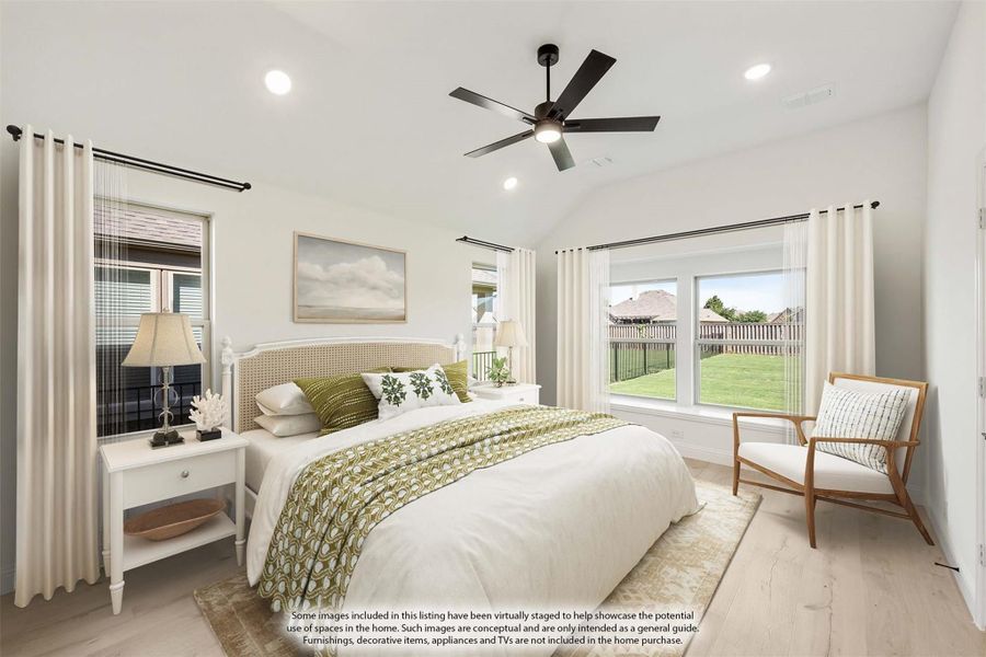 Bedroom with vaulted ceiling, ceiling fan, hardwood floors, and large windows with backyard view