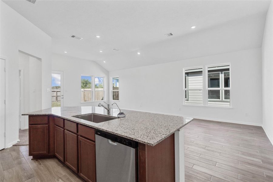 This impressive central island offers seating for guests and a generous prep space, making it a natural hub for parties and family get-togethers.