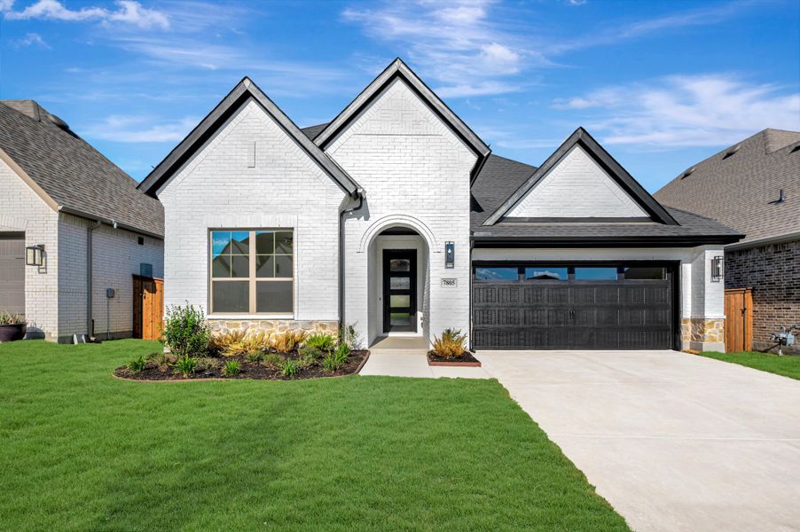 Front exterior of a new home in Tavolo Park Cottages, Fort Worth, TX, highlighting curb appeal (Image 1). Front exterior of a new home in Tavolo Park Cottages, Fort Worth, TX, highlighting curb appeal (Image 1).