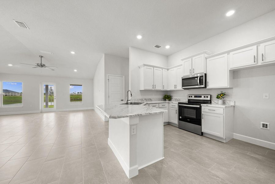 Representative furnished interior of a home built from the 1635 by Adams Homes in Winding Oaks, Weeki Wachee (Image 8).