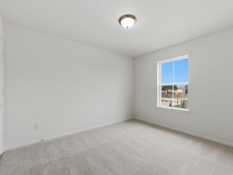 Spacious secondary bedrooms offer flexibility for family, guests, or a home office.