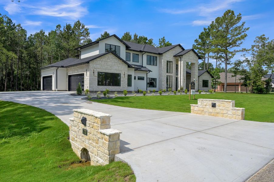 Front exterior of a new home in , Montgomery, TX, highlighting curb appeal (Image 25). Front exterior of a new home in , Montgomery, TX, highlighting curb appeal (Image 25).