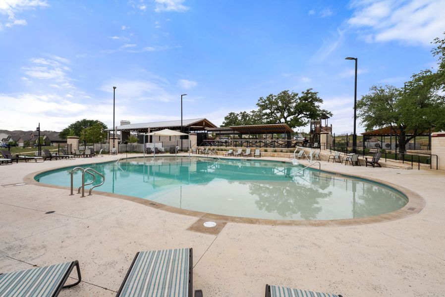 Community pool featuring a patio