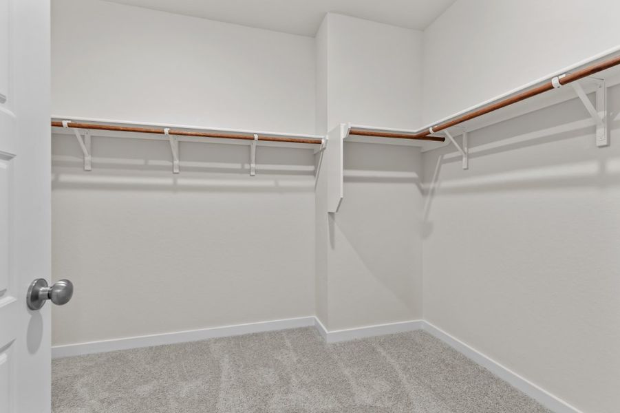 A white room with a white wall and a metal railing. A white room with a white wall and a metal railing.