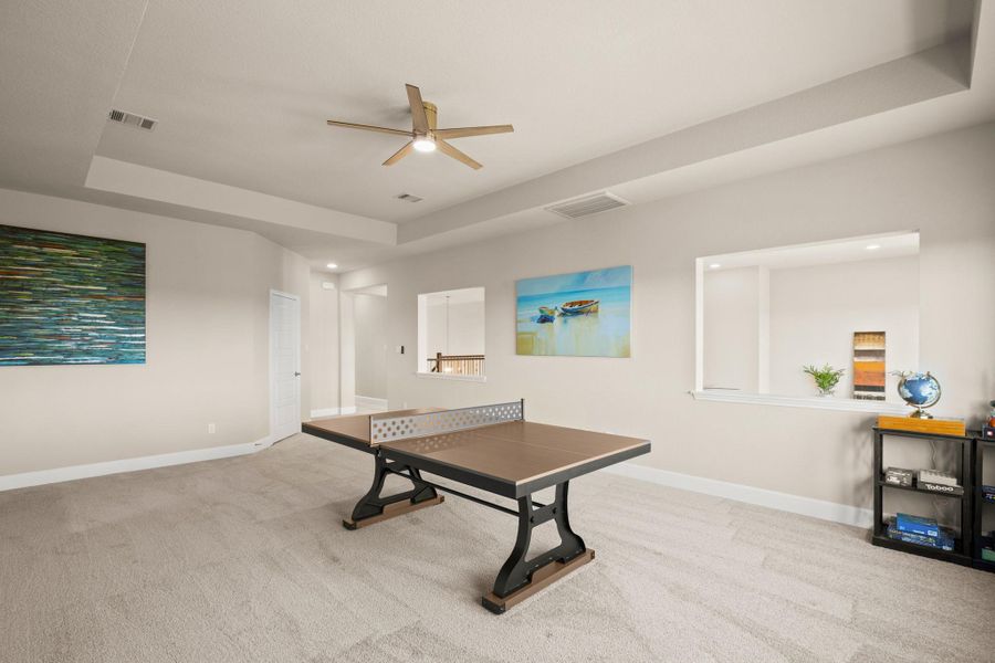 Rec room featuring a raised ceiling, light carpet, ceiling fan, and recessed lighting Rec room featuring a raised ceiling, light carpet, ceiling fan, and recessed lighting