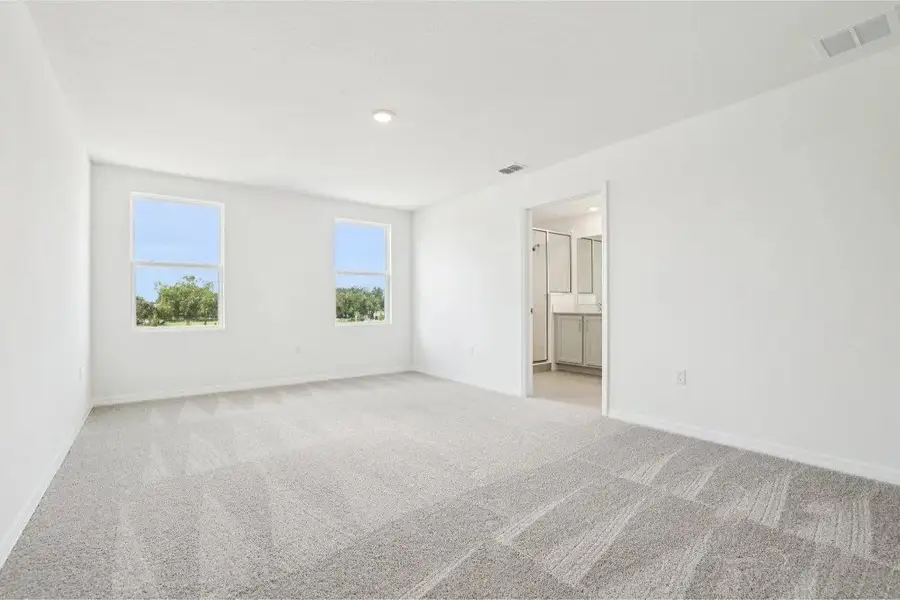 Spacious, unfurnished interior of a new home in Ardisia Park, New Smyrna Beach (Image 22).