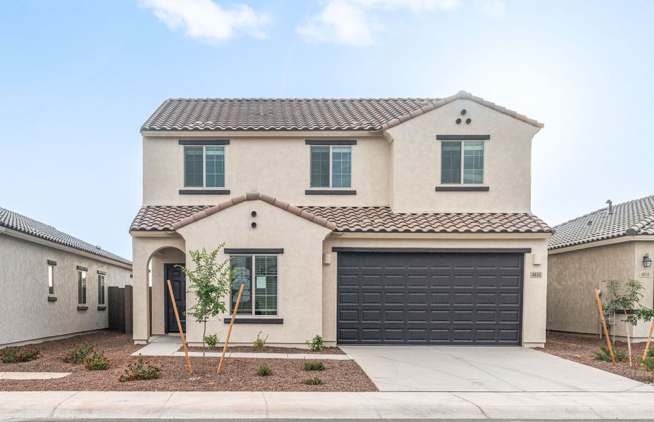 Front exterior of a new home in Copper Falls, Buckeye, AZ, highlighting curb appeal (Image 18).