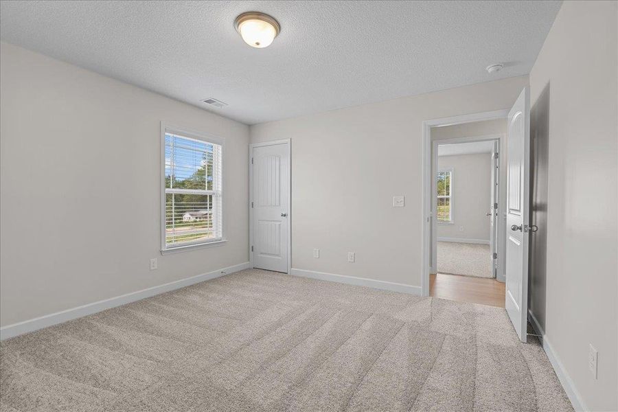 Spacious, unfurnished interior of a new home in Fall Creek, Inman (Image 21).