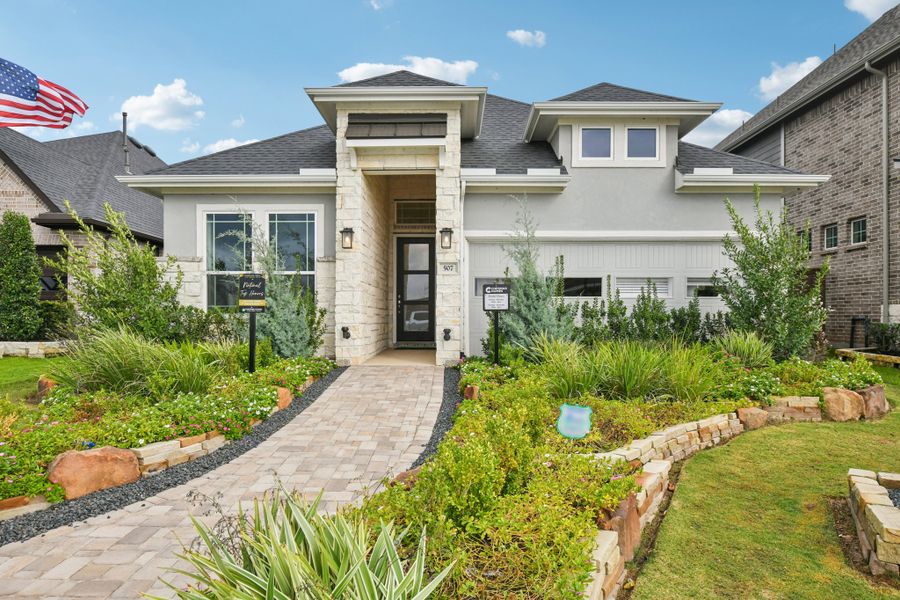 Front exterior of a new home in Wood Leaf Reserve, Tomball, TX, highlighting curb appeal (Image 24).