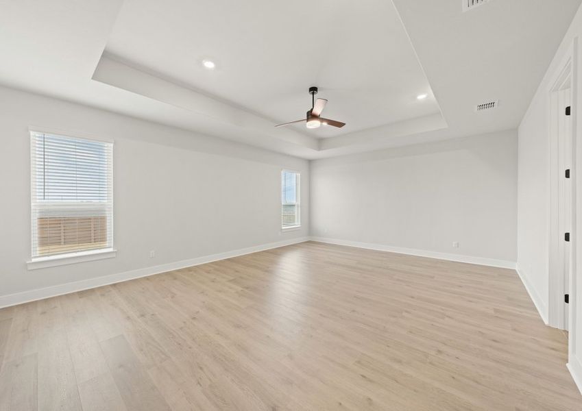The master bedroom has two large windows that let in great, natural light.