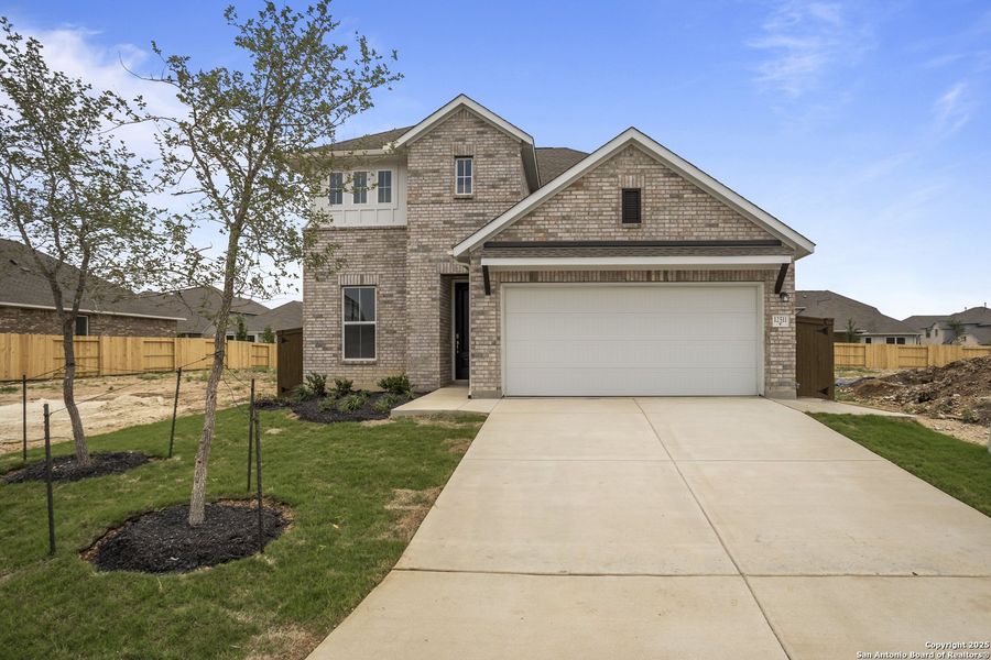 Front exterior of a new home in Stillwater Ranch, San Antonio, TX, highlighting curb appeal (Image 17).