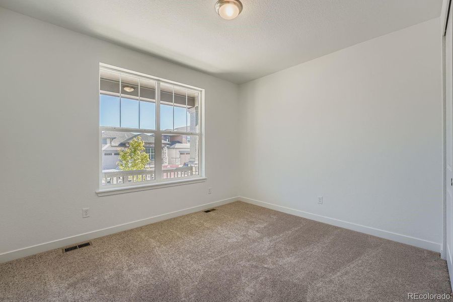 Spacious, unfurnished interior of a new home in Ken-Caryl Ranch: The Monarch Collection, Littleton (Image 9).