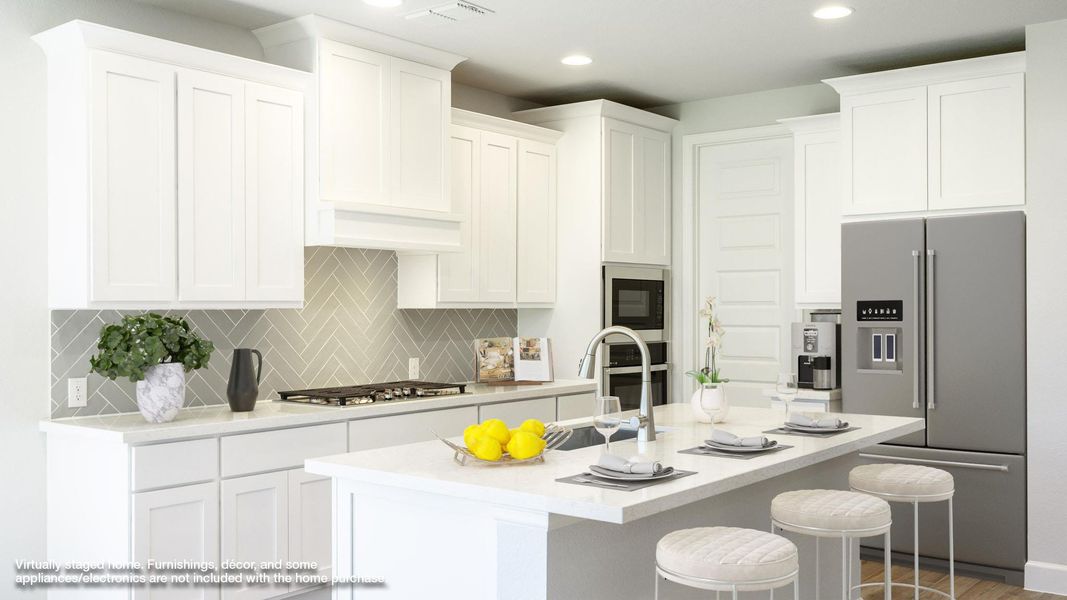 Kitchen with stainless steel appliances, backsplash, a kitchen breakfast bar, white cabinetry, and a center island with sink Kitchen with stainless steel appliances, backsplash, a kitchen breakfast bar, white cabinetry, and a center island with sink