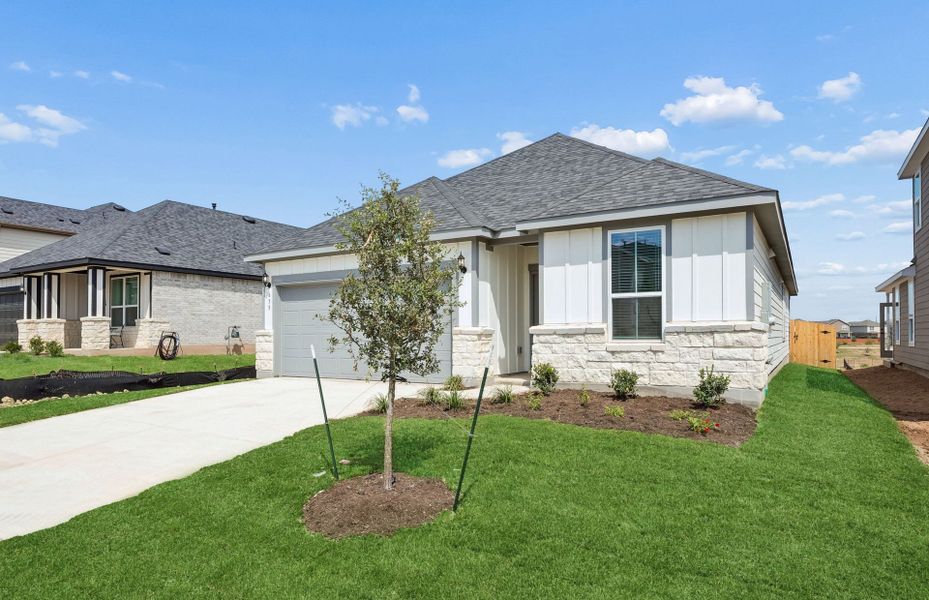 Front exterior of a new home in Sunfield, Buda, TX, highlighting curb appeal (Image 19).