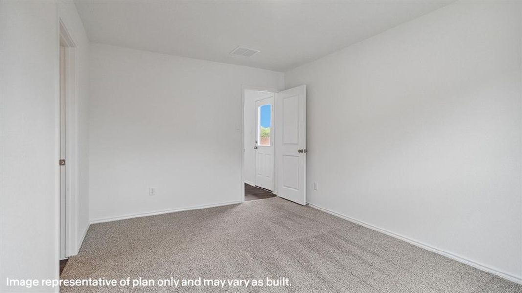 Empty room with carpet flooring and baseboards