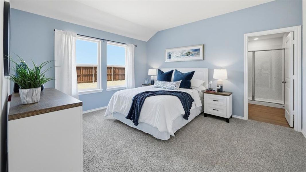 Room featuring light blue walls, gray carpet, and two windows