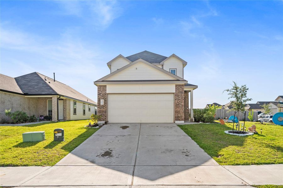 Front exterior of a new home in , Huntsville, TX, highlighting curb appeal (Image 22).