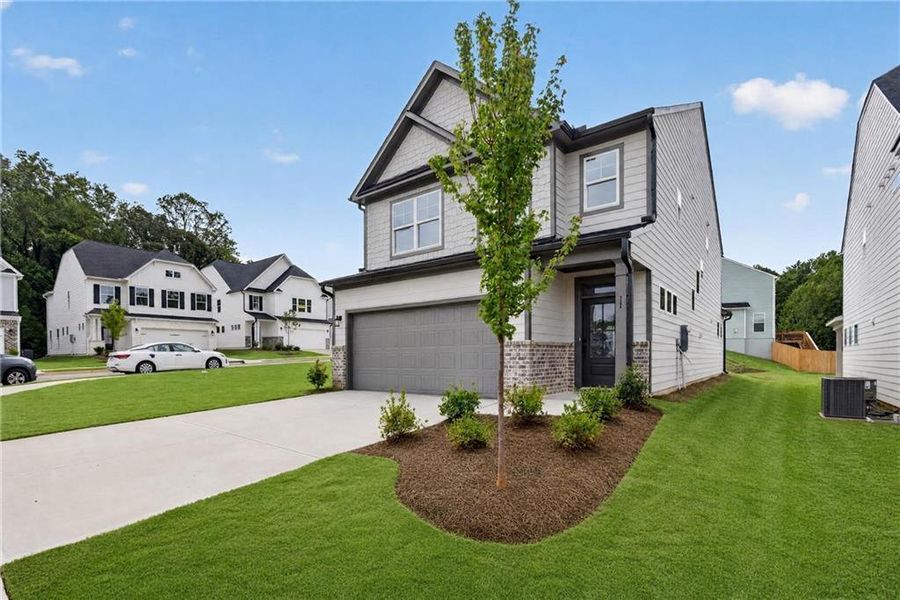 Front exterior of a new home in Villas at Dawsonville, Dawsonville, GA, highlighting curb appeal (Image 27). Front exterior of a new home in Villas at Dawsonville, Dawsonville, GA, highlighting curb appeal (Image 27).
