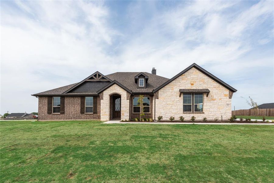 Front exterior of a new home in Nash Estates, Tom Bean, TX, highlighting curb appeal (Image 18).