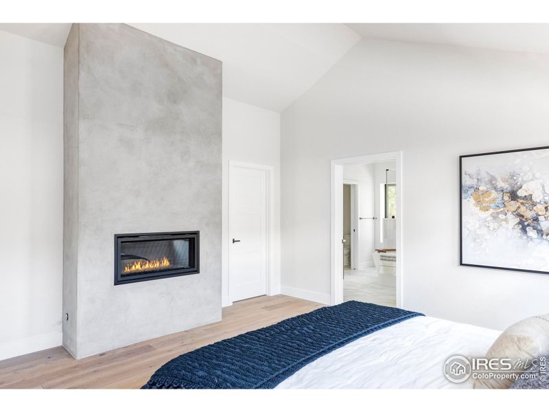 This home's comfortable accommodations begin on the upper level, where the stunning owner's retreat boasts a fireplace trimmed by a custom limewash.