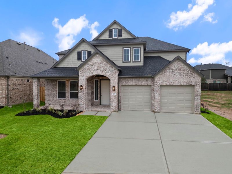 Front exterior of a new home in Barton Creek Ranch, Conroe, TX, highlighting curb appeal (Image 13). Front exterior of a new home in Barton Creek Ranch, Conroe, TX, highlighting curb appeal (Image 13).
