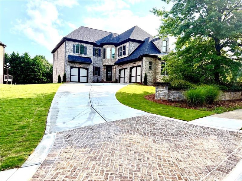 Front exterior of a new home in , Snellville, GA, highlighting curb appeal (Image 1). Front exterior of a new home in , Snellville, GA, highlighting curb appeal (Image 1).