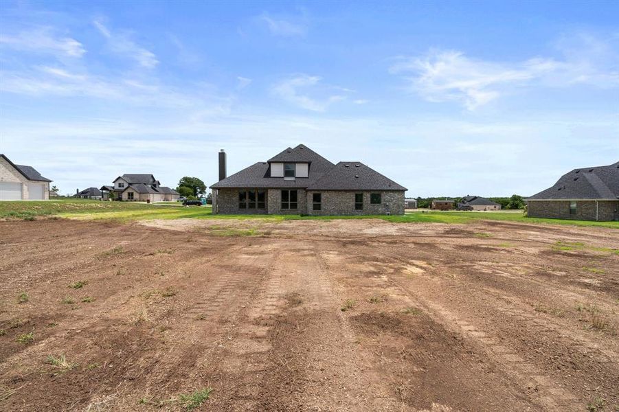 Front exterior of a new home in , Waxahachie, TX, highlighting curb appeal (Image 24).
