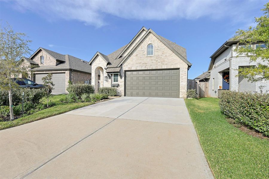 Front exterior of a new home in Grand Central Park: 40ft. lots, Conroe, TX, highlighting curb appeal (Image 26). Front exterior of a new home in Grand Central Park: 40ft. lots, Conroe, TX, highlighting curb appeal (Image 26).