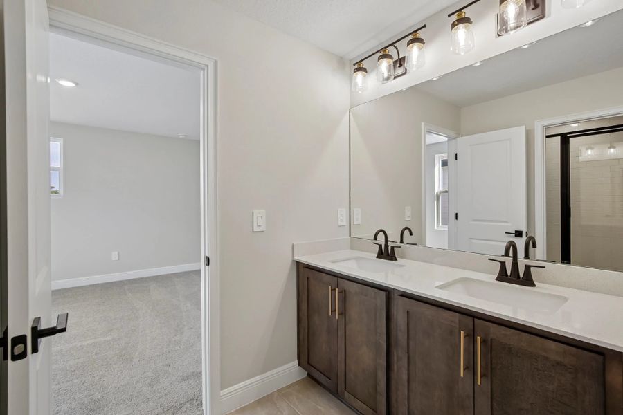 Bathroom 2 is a jack and jill bathroom that connects bedroom 3 and 4 featuring aspects of AW Collection® Oxford