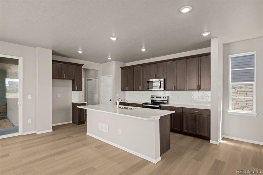 Furnished interior view inside a new home in Painted Prairie, Aurora (Image 6).