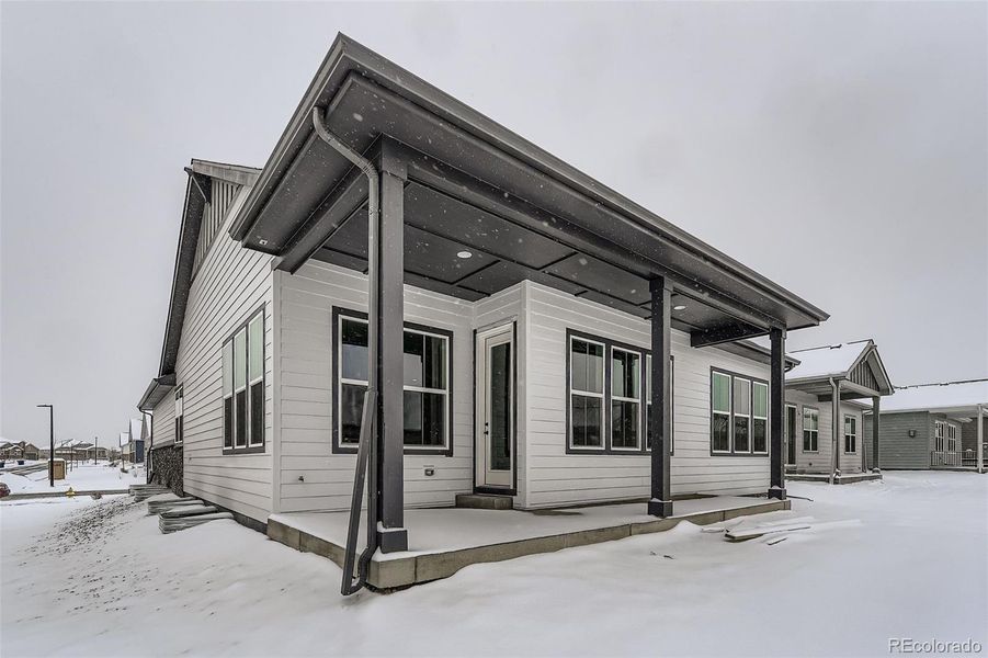 Exterior details and patio area of a home in Hilltop 55+ at Inspiration 55s, Aurora (Image 16).